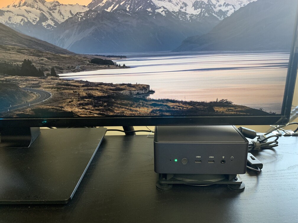Beneath the monitor